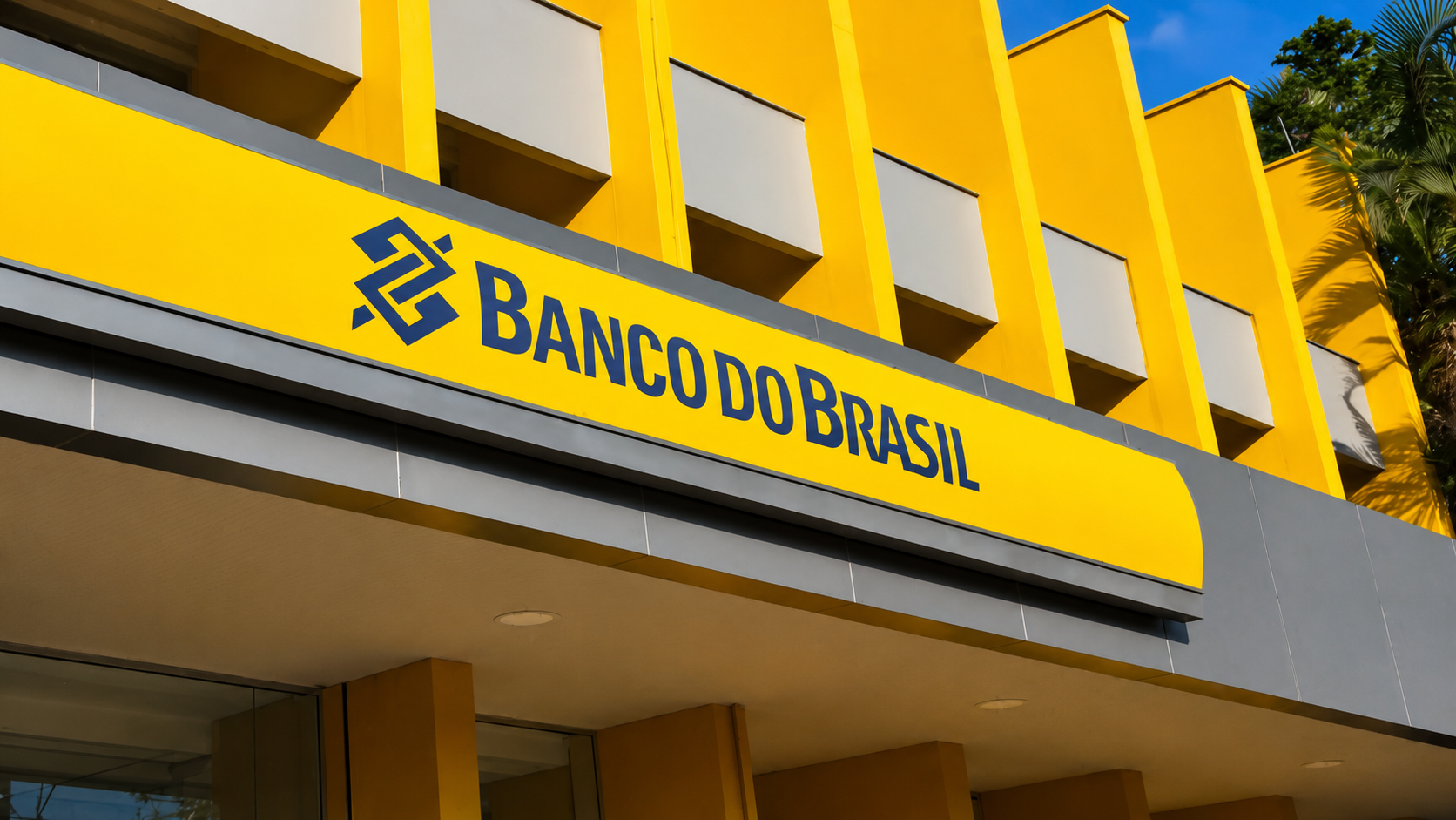 Fachada amarela da agência do Banco do Brasil com logo oficial